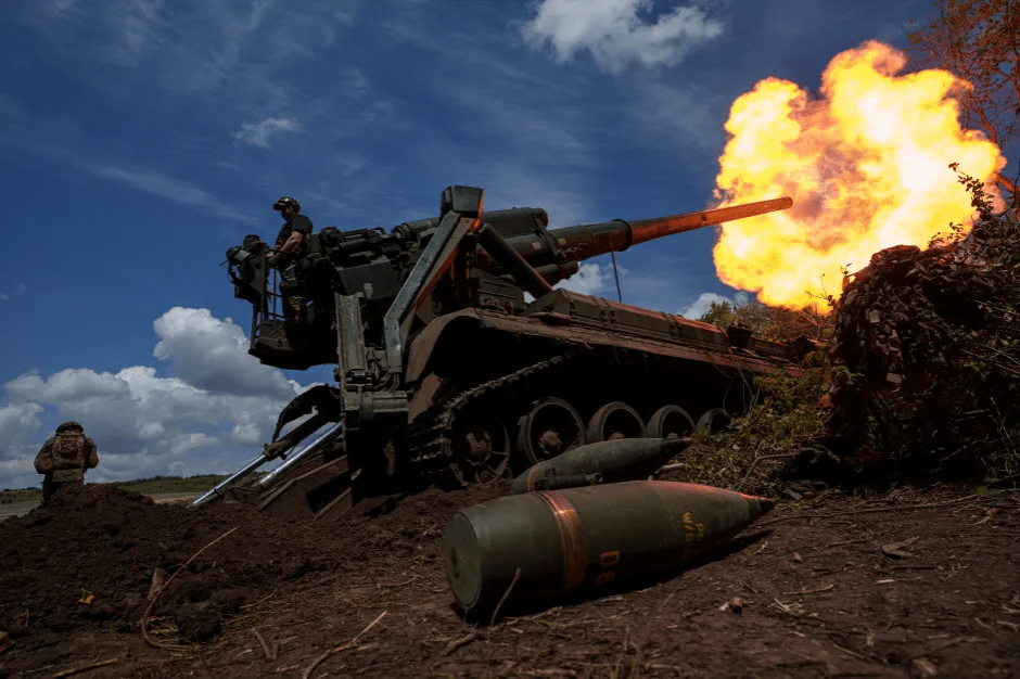 Self-propelled howitzer firing.