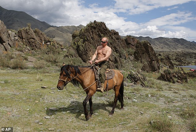 Putin in 2009 riding a horse while traveling in the mountains of the Siberian Tyva region