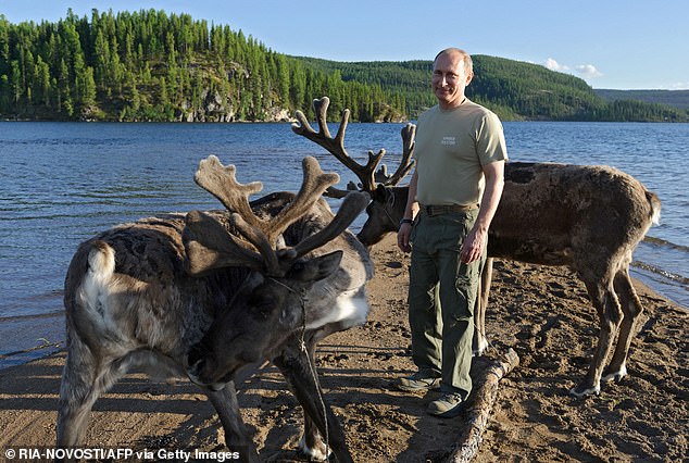 Putin with reindeer during a holiday in the Tyva region in 2013