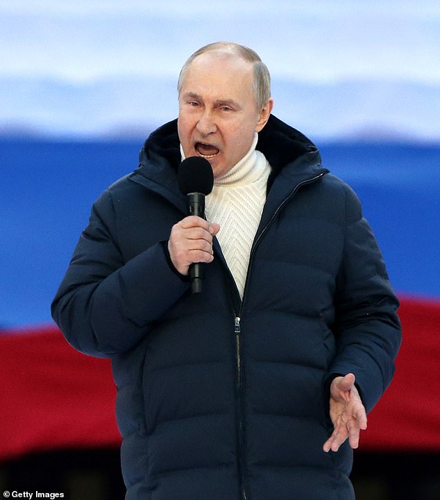 Vladimir Putin speaks during a concert marking the anniversary of the annexation of Crimea, on March 18, 2022, in Moscow