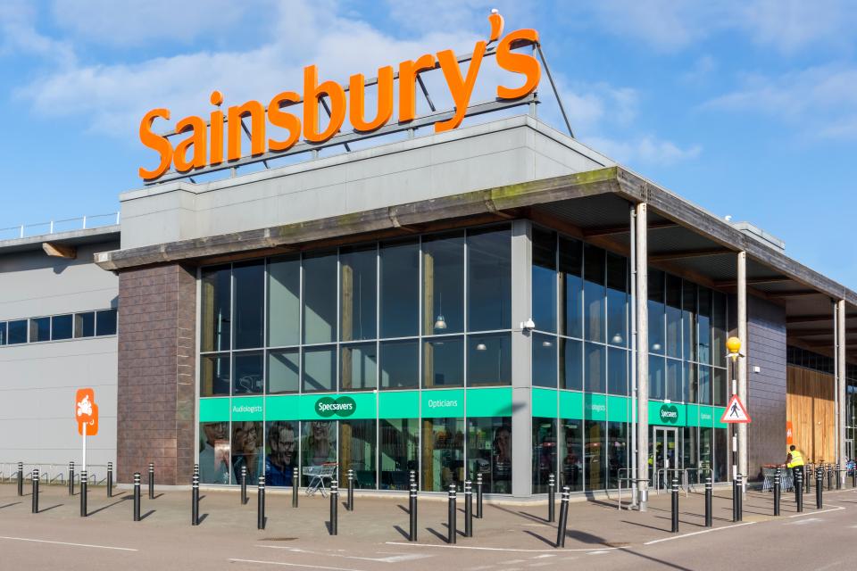 PDG279 A branch of Sainsbury's containing a Specsavers opticions in King's Lynn, Norfolk.