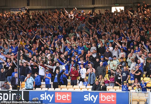 Cardiff City fans cheer their side on at Vale Park during a 0-0 draw last week