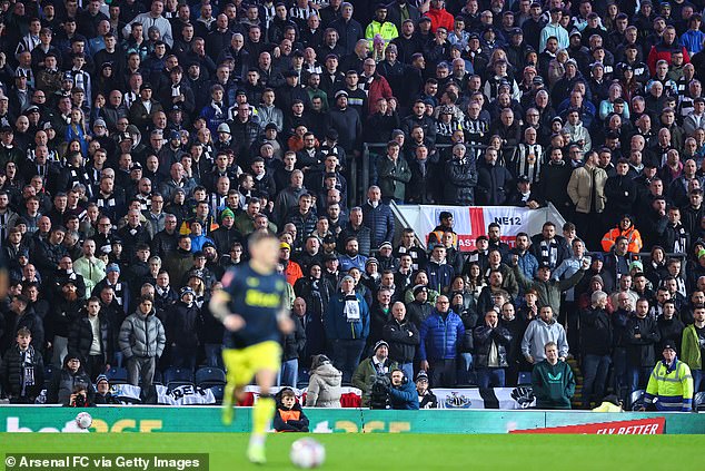 Arsenal fans enjoy themselves in the Tottenham away end after going 3-0 up in April 2024