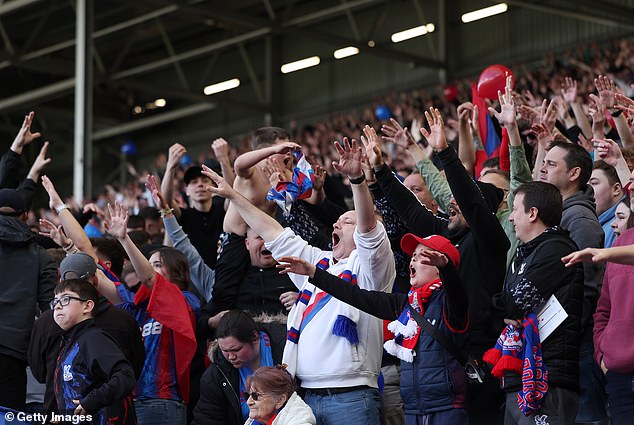 Crystal Palace fans celebrate during their FA Cup quarter-final win at Fulham last season