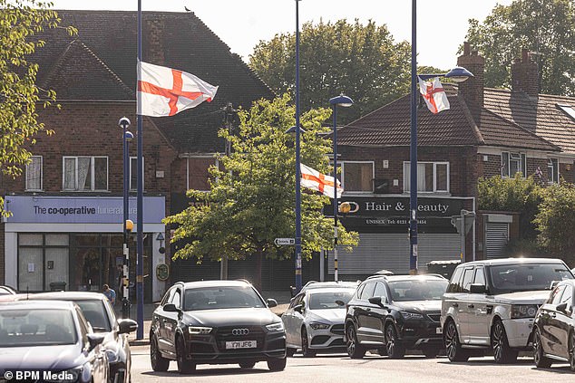 The patriotism has also led to accusations that those responsible are looking to stir up division between white British residents and other communities in the area. Pictured: Flags seen in Weoley Castle
