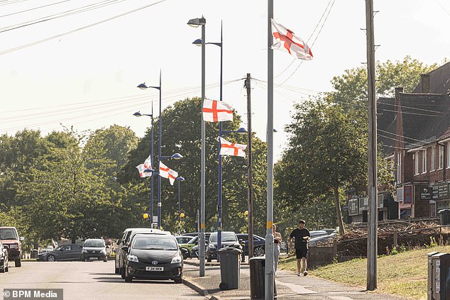 St George's flags line the streets of Weoley Castle. They have been put up by a group of 'proud English men'