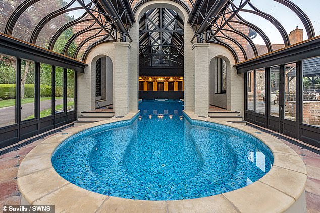 The leisure complex houses a 100,000 litre pool, part of which is enclosed by a glass pavilion with its curved glass roofline