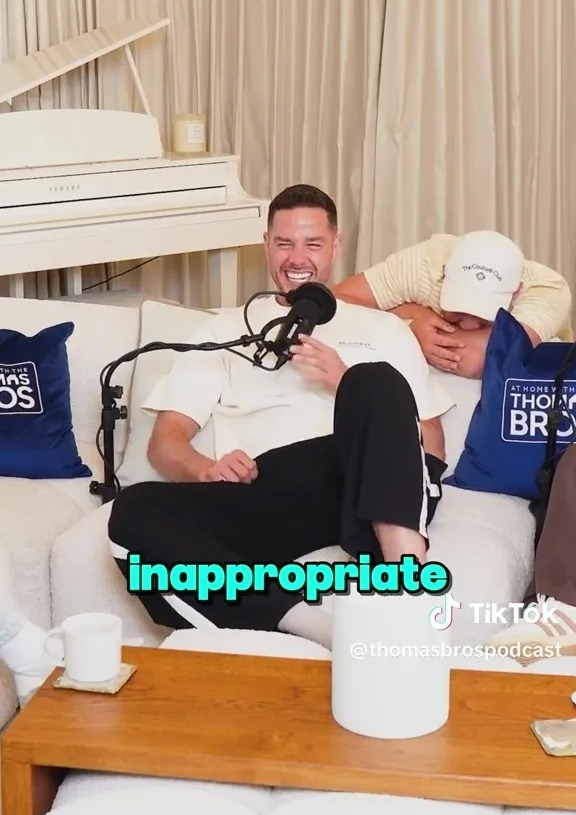 Two men recording a podcast.