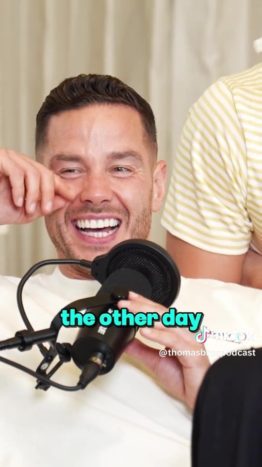 Screenshot of Scott Thomas laughing while speaking into a microphone on the Thomas Bros Podcast.