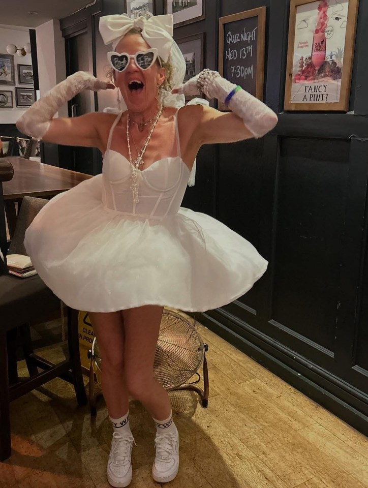 Lorraine Stanley in a white minidress at a hen party.