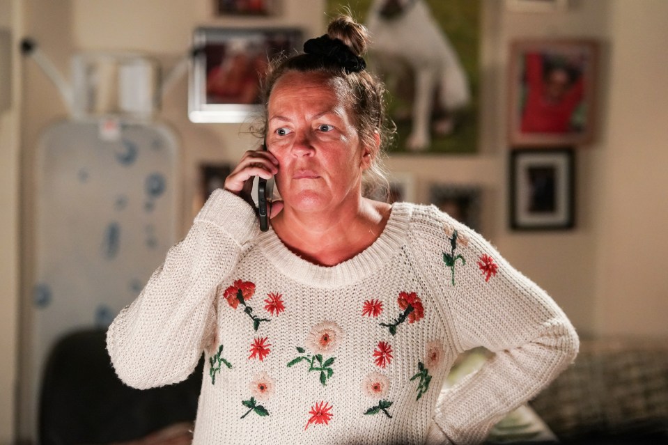 Lorraine Stanley as Karen Taylor on the phone.