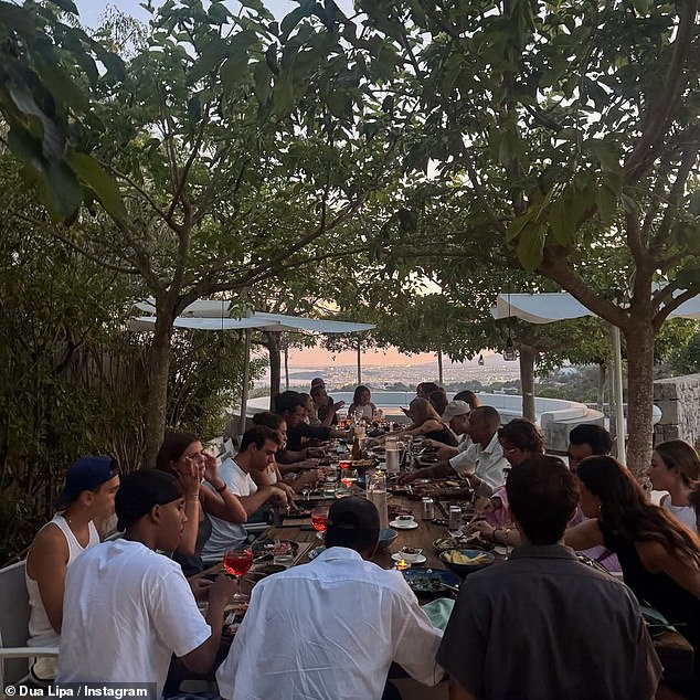 The singer also enjoyed a feat with her friends as the Spanish sunset behind them, with a view looking out to Ibiza and beyond