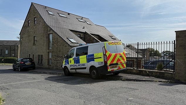 The teenager has been released on conditional bail following the arrest (Pictured: a police car on on Sheepridge Road, Huddersfield)