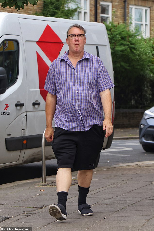 The former presenter - who is now 58 - was spotted enjoying a stroll through leafy West London as he enjoyed the summer heat