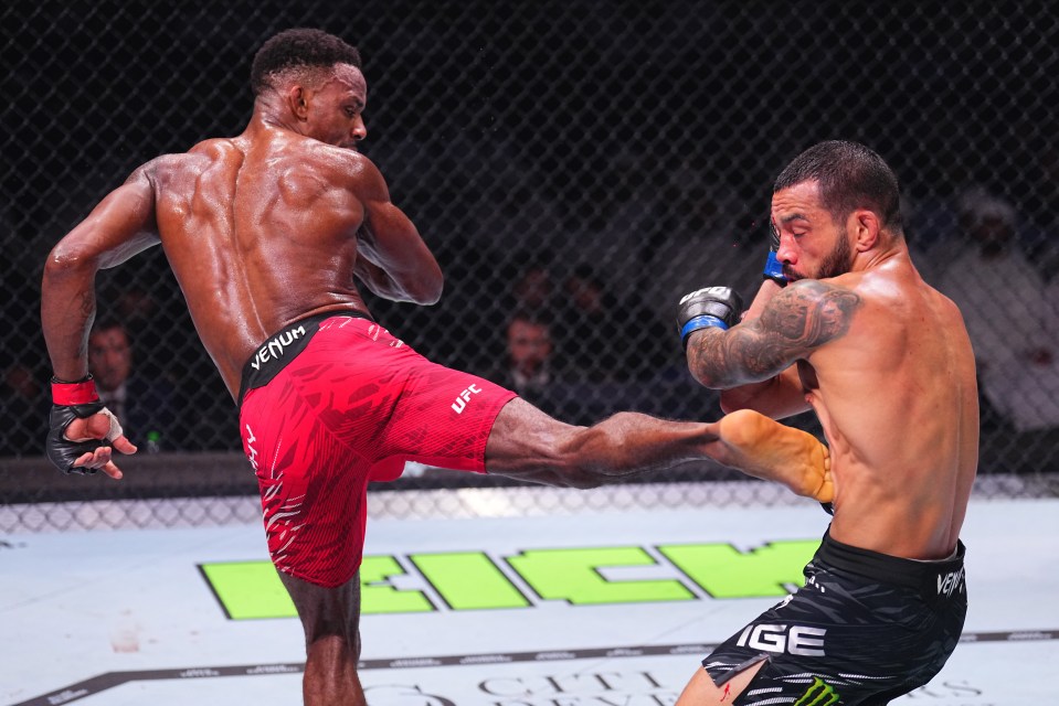 Lerone Murphy kicks Dan Ige during a UFC featherweight fight.