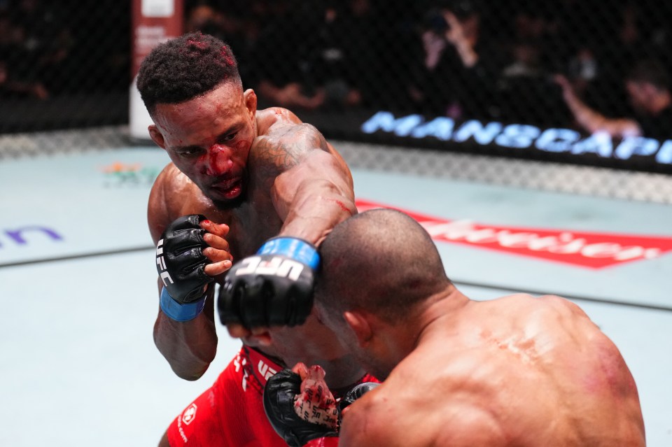 Lerone Murphy of England and Edson Barboza of Brazil boxing during a UFC featherweight fight.