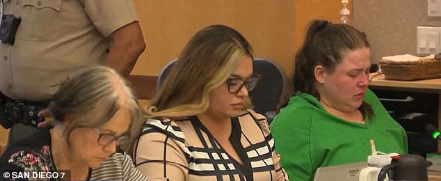 Lyon is pictured in court with her defense team. The couple's victims were aged between three and seven years old and some were autistic and non-verbal