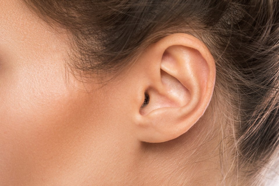 Close-up of a woman's ear.