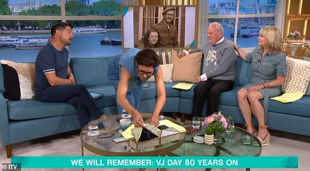 Emma got up from her seat and rushed to the coffee table to hand Gyles a tissue (pictured)