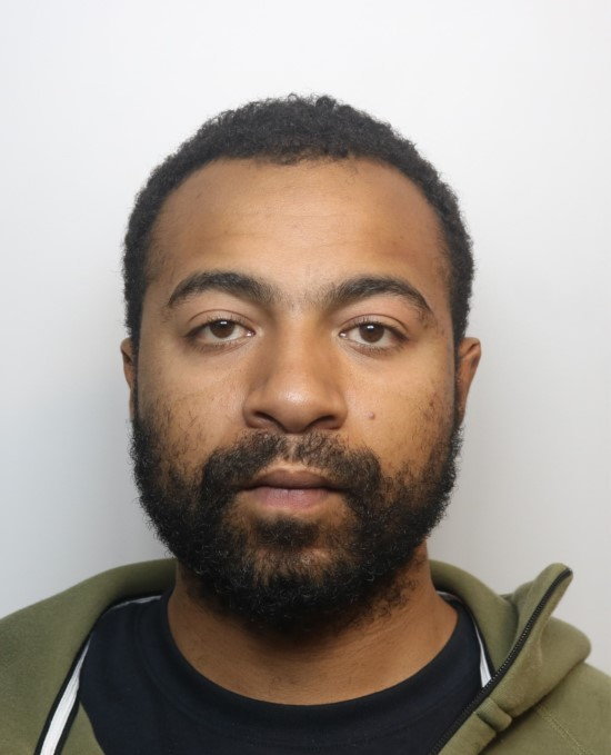 Mugshot of Marlon Henriques.
