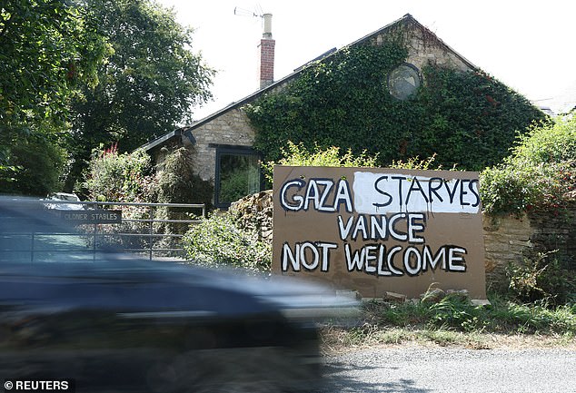 A sign reading 'Gaza Starves, Vance Not Welcome' is displayed outside a home near Chipping Norton in the Cotswolds
