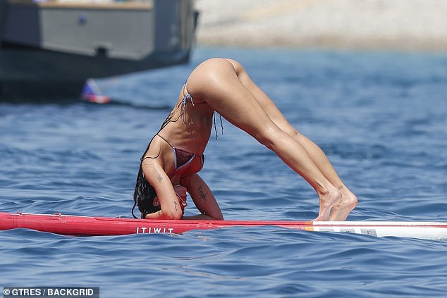 The songstress seamlessly performed the Downward Facing Dog to start off her yoga morning