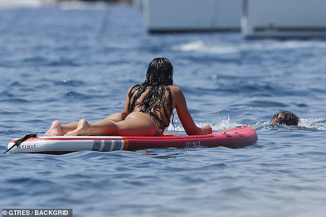 She cheekily flashed her bottom