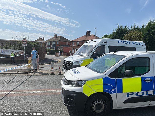 Mr Stogden's heartbroken daughters have paid tribute to their beloved father, pleading with the gunman responsible for his 'cruel' death to come forward. They added that they have been left in 'complete shock' by the unexpected loss of their father. Pictured: police cars at the scene