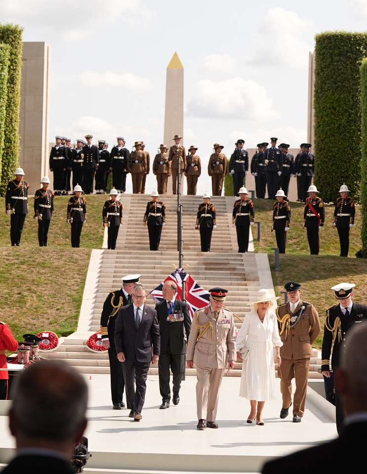 King Charles III and Queen Camilla arrive at a VJ Day remembrance service.