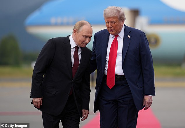 Trump greets Russian President Vladimir Putin as he arrives at Joint Base Elmendorf-Richardson on August 15, 2025 in Anchorage, Alaska. The two leaders are meeting for peace talks aimed at ending the war in Ukraine. (Photo by Andrew Harnik/Getty Images)