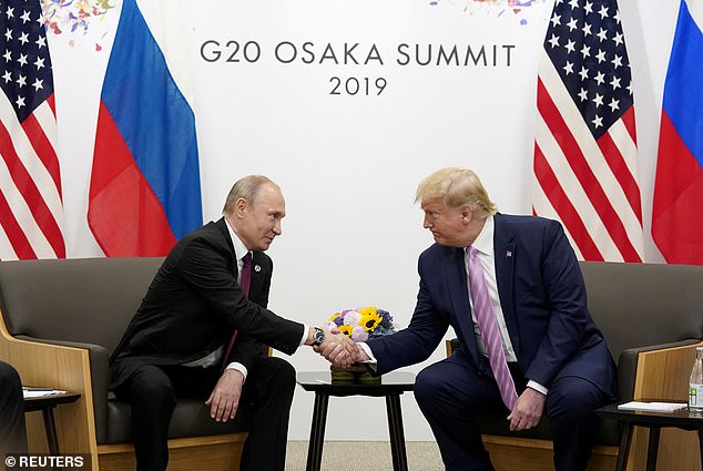 Russia's President Vladimir Putin and US President Donald Trump shake hands during a bilateral meeting at the G20 leaders summit in Osaka, Japan in 2019