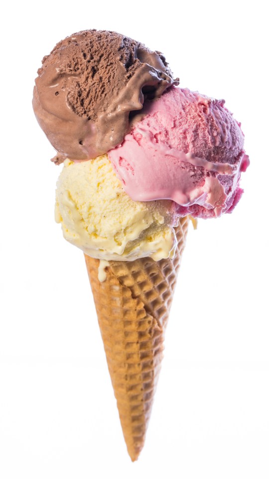 Ice cream cone with chocolate, strawberry, and vanilla scoops.