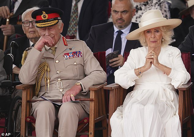 The pair appeared visibly emotional after a veteran went 'off-script' to salute the monarch during the VJ Day service today