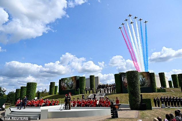 The aerobatic display team of the Royal Air Force, The Red Arrows fly overhead during the service