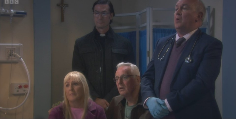 Still image from Mrs. Brown's Boys showing Agnes' family gathered in a hospital room.