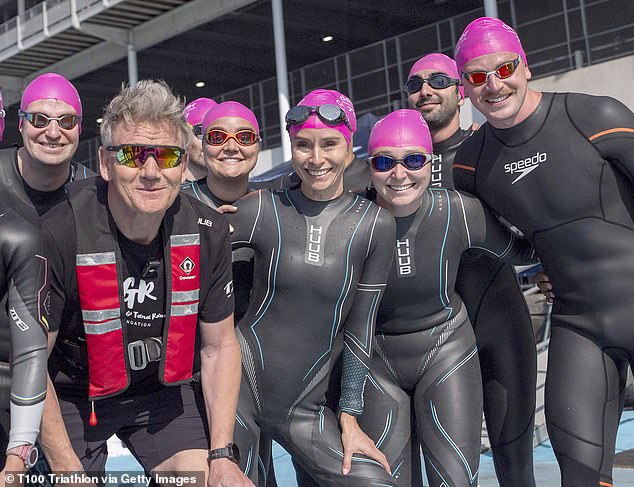Gordon Ramsay (second from left) and family members, including future son-in-law swimmer Adam Peaty (far right), pose as they get ready to take part in the London T100 Triathlon on August 10, 2025 in London