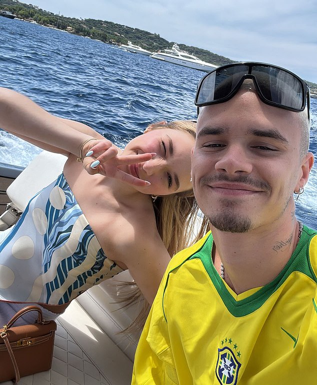 Romeo Beckham, wearing a Brazilian football jersey, on a boat with sister Harper in Saint-Tropez