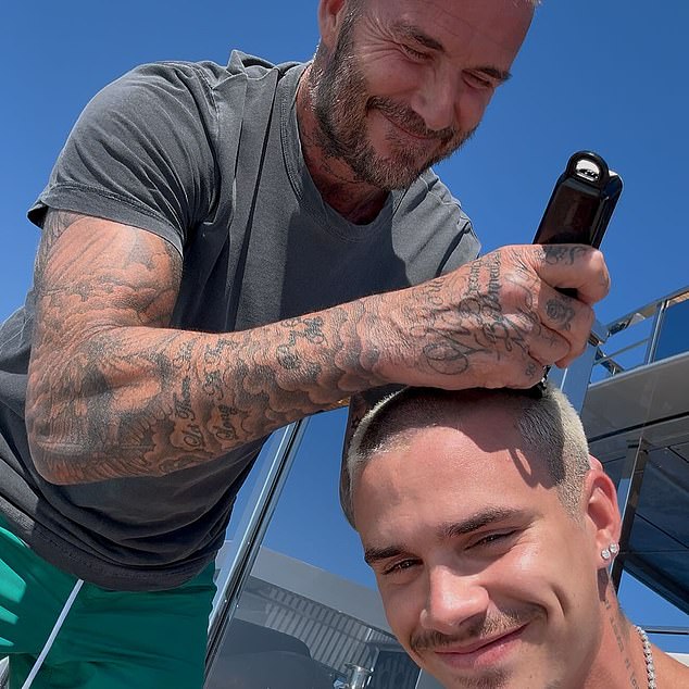 Romeo Beckham has his head shaved by David