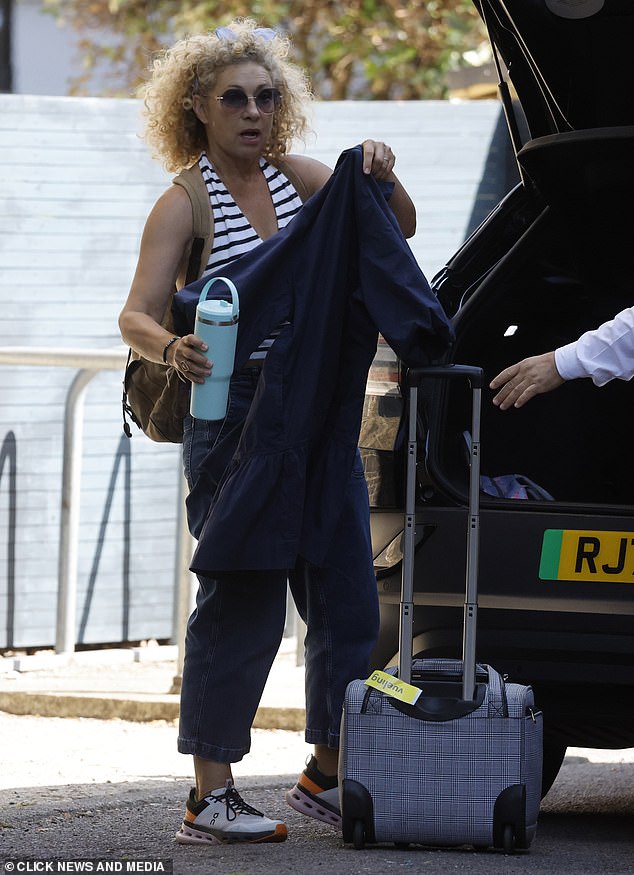 Alex Kingston appeared serious as she gathered her things