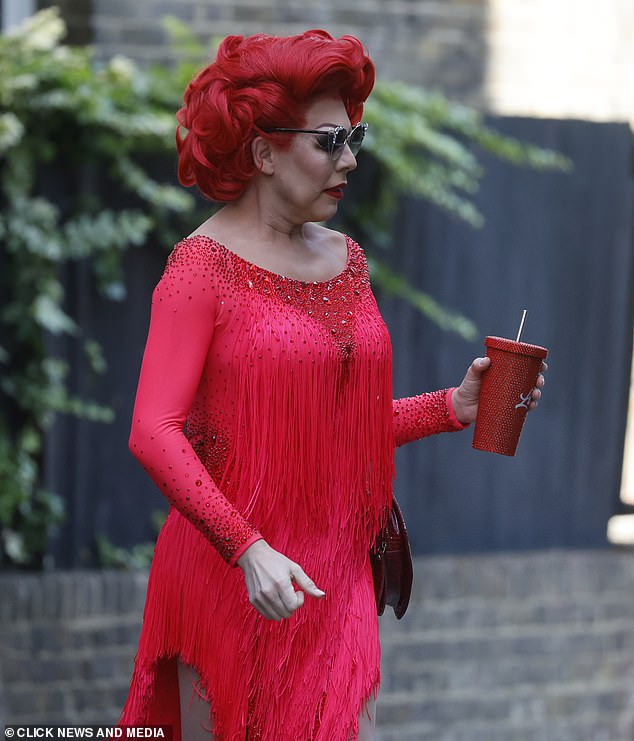The Drag performer ensured her red ensemble was perfectly coordinated as she arrived