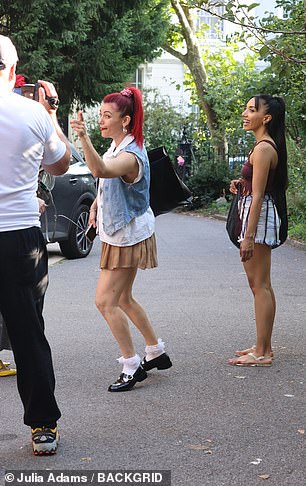 The group appeared to be in a playful mood after their first day back
