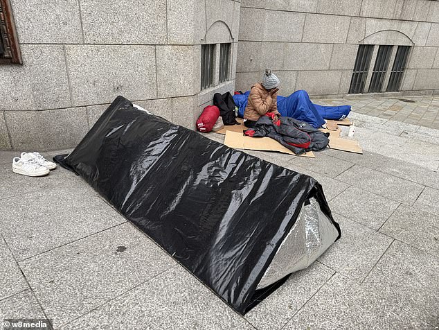 Migrants sleep outside overnight by Westminster Cathedral in central London
