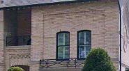 Cropped Google Street View image of a brick house.