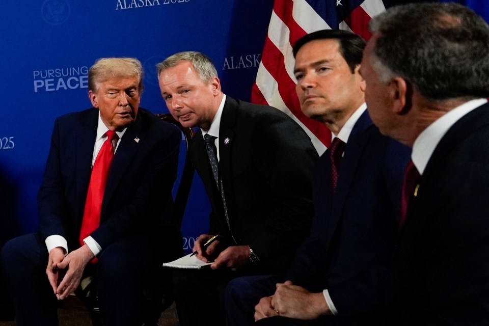 President Trump with his translator and other officials.