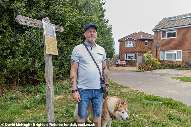Resident Shaun Lowndes with dog Chief - Shaun had originally moved to the area for the peace and quiet, which will disappear if the plans go ahead