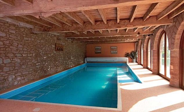 A swimming pool (pictured) is currently housed in the barn where Hammond lives