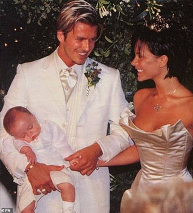 David and Victoria Beckham are pictured on their wedding day in 1999 with their young son, Brooklyn