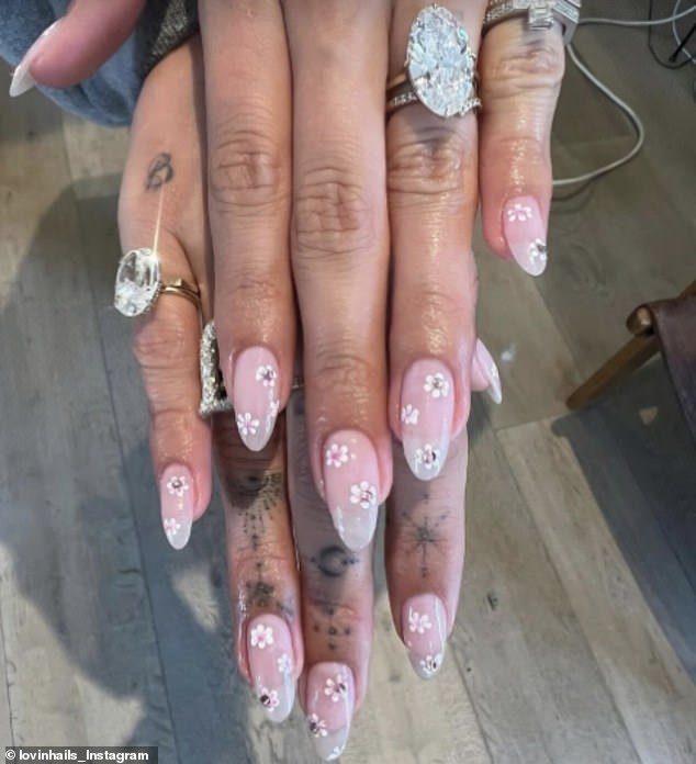 Fan pages have given a closer look at her huge new rock on her wedding finger after she had a manicure, with her original engagement ring now seen on her little finger