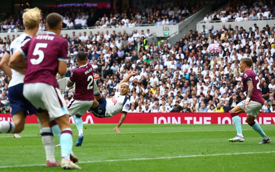 Richarlison scoring a soccer goal.