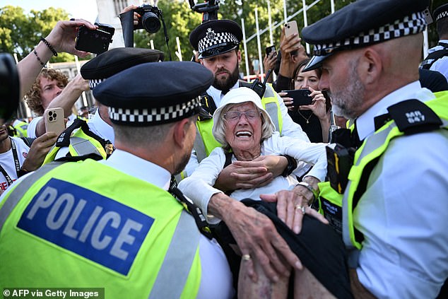 An 89-year-old protester is arrested during the 'Lift the Ban' demonstration in London